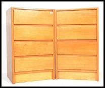 A pair of 1950's retro plywood chest of drawers having a configuration of 4 draws each on plinth