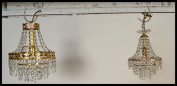 A near pair of  20th Century cut glass droplet beaded and gilt brass light fixtures,