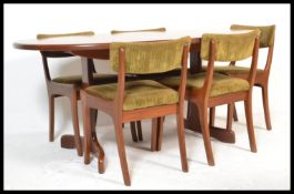 A  retro 20th Century G-Plan Fresco range extendable teak wood dining table together with a set of