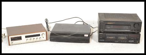 A retro circa 1980's music stacking system by Sony with a black finish.