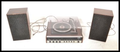 A retro 20th Century Ultra Group Stereo record deck, set within a dark wood case and chrome