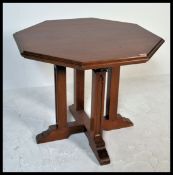A 19th Century Victorian oak and pine window occasional table raised on open base. The octagonal top