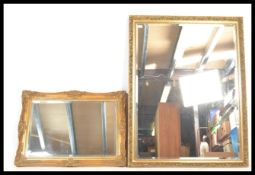A large antique style 20th century rococo wall mirror - overmantel. The cushion frame with detailing