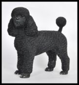 A contemporary Leonardo 2002 high detail resin model of a poodle being signed to base. Black