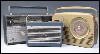 A group of three vintage retro 20th Century radios to include a Grundig Yacht Boy, Hacker radio