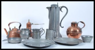 A collection of late 19th Century / early 20th Century pewter wares to include a lidded pitcher
