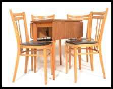 A set of four vintage retro 20th Century Ercol style Czechoslovakian dining chairs along with a