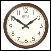 A vintage retro 20th century industrial  factory / school wall clock of circular form with