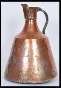 An 18th Century Georgian copper pitcher pourer jug having a wrought iron riveted handle with