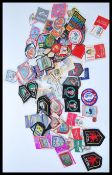A collection of vintage and retro 20th Century sew on badges to include scouts and guides interest