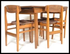 A retro 20th Century laminated extendable dining table together with a set of four butterfly back