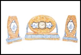 An antique Delft clock and garniture set consisting of  a central barrel clock movement within