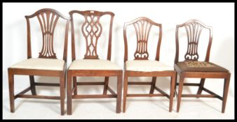 A harlequin set of four 19th Century splat back dining chairs to include a Chippendale revival chair