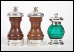 A pair of wooden and silver hallmarked contemporary pepper grinders along with a boxed Hamilton