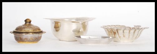 A group of silver to include a 835 silver ten sided trinket / pin dish, stamped silver lidded pot