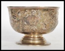 An early 19th Century Georgian hallmarked silver centerpiece table bowl having later clobbered