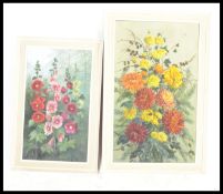 Muriel England English 20th Century - A pair of still life oil paintings depicting flowers set to