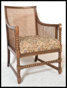 A 1930's Art Deco mahogany Bergere Armchair originally retailed by PE Gane of Bristol ( label