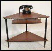 A retro 20th Century two tiered corner telephone table together with a vintage Belgium made Bell