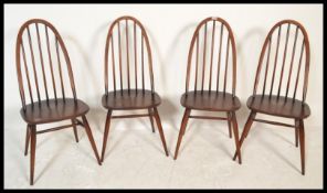 A set of four vintage 20th Century Ercol elm and beech 'Windsor' hoop back dining chairs, model 370,