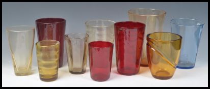 A group of mostly Whitefriars 20th Century studio art glass vases to include Whitefriars Swag bucket