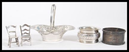 A collection of 20th century silver items to include tow miniature dolls house chairs (stamped 925),