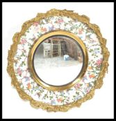 An early 20th century Burleigh Ware ceramic charger, ormolu gilt surround hand painted with birds