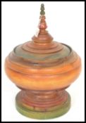 A 20th Century large wooden Indian / Middle Eastern centerpiece / spice jar having hand painted