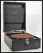 A vintage early 20th Century portable picnic gramophone by Linguaphone in black leatherette case.