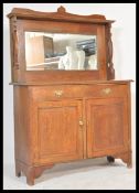 A late 19th century Arts & Crafts oak mirror back