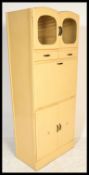 A vintage mid 20th Century upright kitchen cupboard, having an arrangement of drawers and cupboards,