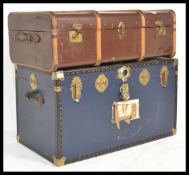 A good collection of vintage luggage to include a group of Edwardian ledger boxes, a canvas bound