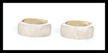 A pair of stamped 375 9ct gold hoop earrings. Weight 2.8g. Measures 17mm diameter.