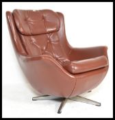 An original 1960's retro vintage button back swivel egg type chair / armchair being raised on a five