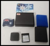 A collection of Royal Mint type coins to include two silver proof one pound coins, D-Day coin,