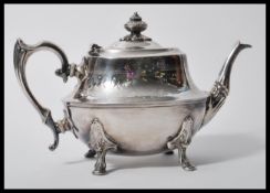An early 20th Century silver plated teapot by along with a set of four vintage pewter tankards