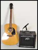 A 20th Century six string acoustic guitar by Epiphone together with an electric amp and speaker by