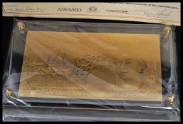 An unusual replica of a £50 note having three grams of 24ct gold overlaid. Complete in fitted case