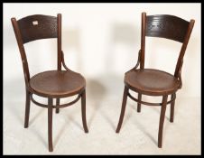 A pair of vintage 20th Century Circa 1920's bentwood Thonet style bentwood Cafe / Bistro chairs.
