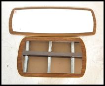 Two vintage retro 20th Century frameless wall mirrors of oblong form. Central mirror panels on