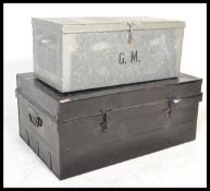 An early 20th Century ebonised metal deed trunk of rectangular form together with another similar.