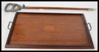 A leather and copper early 20th century shooting stick together with an Edwardian mahogany inlaid