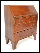 An early 20th Century Edwardian mahogany bureau having fold down writing sciver with fitted interior
