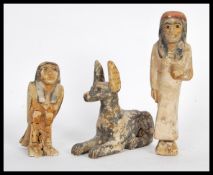 A group of three 20th Century Egyptian revival carved wood burial / tomb figurines having hand