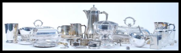 A large collection of silver plate items to include a coffee pot with matching creamer and sugar