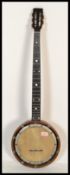 A vintage early 20th century five string banjo, with mother-of-pearl inlaid fretboard and maple