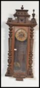 A 19th Century Victorian large Vienna regulator wall clock having a mahogany case with gilt brass