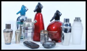 A collection of vintage 20th Century bartending items to include a frosted glass crackle effect