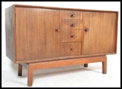 A mid 20th Century vintage retro Alfred Cox walnut sideboard / credenza, central bank of four