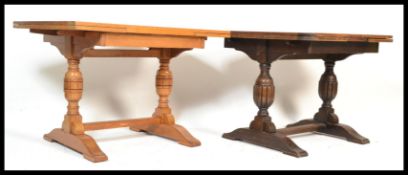 A group of three vintage 20th Century oak draw leaf dining refectory tables in the jacobean style.